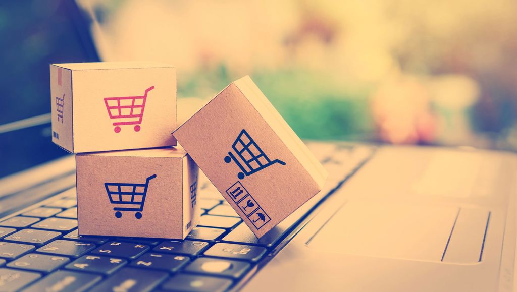 Consumer disputes settled online Three small cardboard boxes on an oversized keyboard